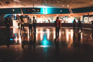 Picture of skaters moving around a roller skating rink